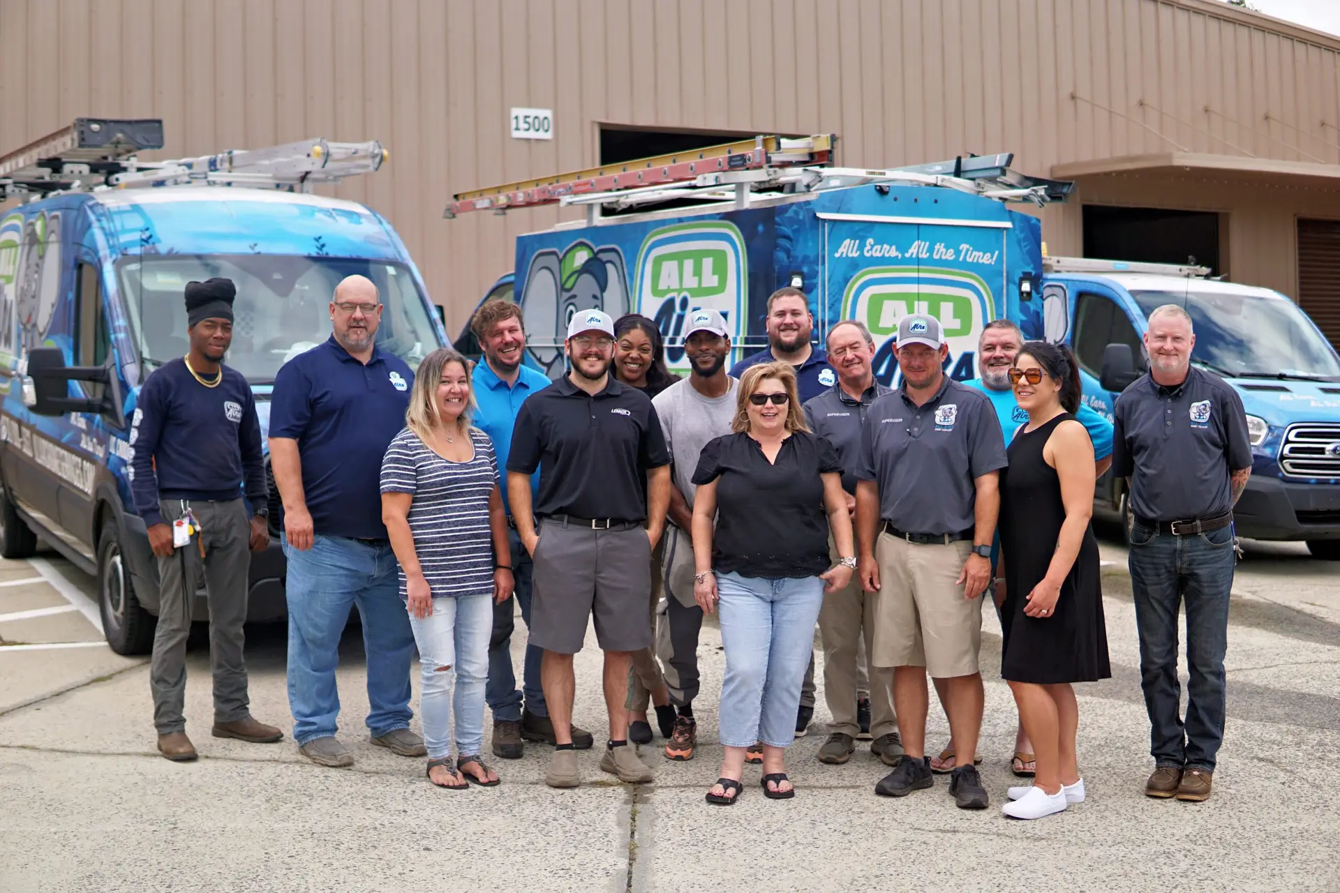 The All Airs Home Services team in front of their vans